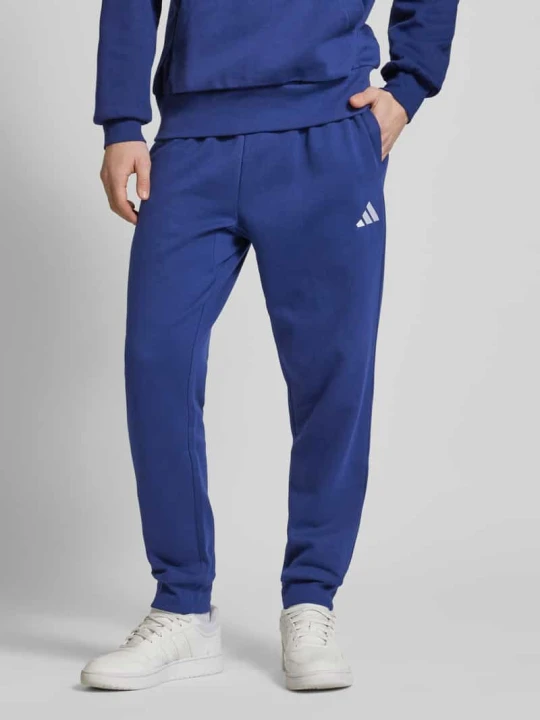 Zdjęcie produktu Spodnie dresowe z elastycznym ściągaczem Adidas Granatowy