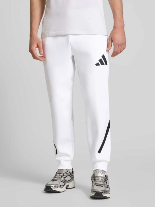 Zdjęcie produktu Spodnie dresowe z elastycznym pasem Adidas Biały