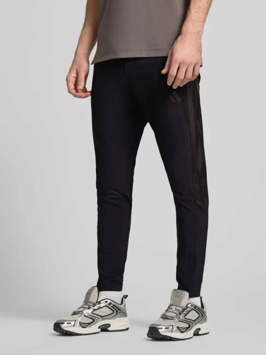 Zdjęcie produktu Spodnie dresowe z elastycznym pasem Adidas Czarny
