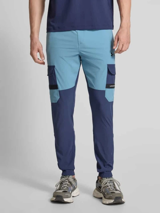 Zdjęcie produktu Spodnie dresowe z elastycznym ściągaczem Under Armour Ciemnoniebieski