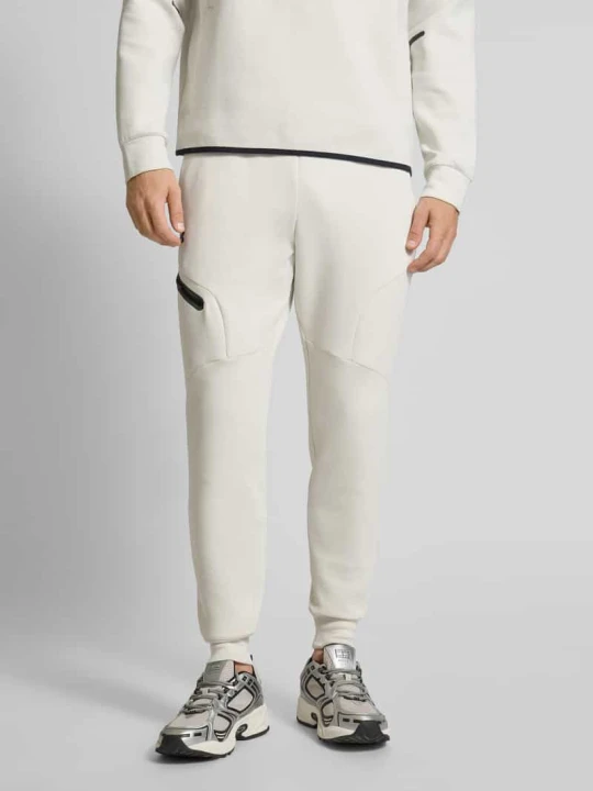 Zdjęcie produktu Spodnie dresowe z elastycznym ściągaczem Under Armour Złamany biały