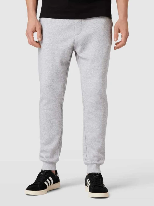 Zdjęcie produktu Spodnie dresowe o kroju regular fit z wpuszczanymi kieszeniami model 'GORDON' Jack&Jones Jasnoszary melanż