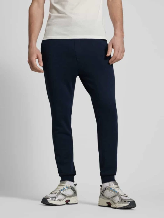 Zdjęcie produktu Spodnie dresowe z kieszenią z tyłu model ‘GORDON JJBRADLEY’ Jack&Jones Ciemnoniebieski