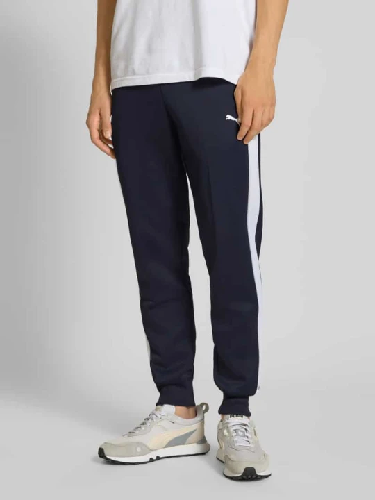 Zdjęcie produktu Spodnie dresowe z kieszeniami zapinanymi na zamek błyskawiczny Puma Granatowy