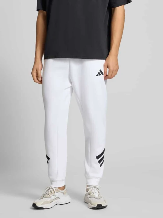 Zdjęcie produktu Spodnie dresowe z logo i elastycznym pasem Adidas Biały