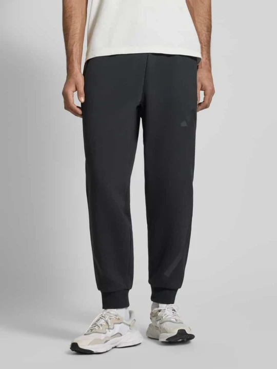 Zdjęcie produktu Spodnie dresowe z logo i elastycznym pasem Adidas Czarny