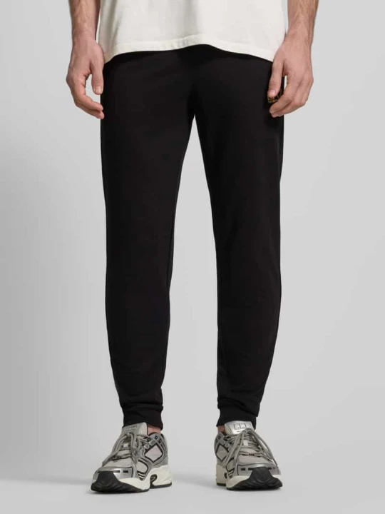 Zdjęcie produktu Spodnie dresowe z logo i elastycznym pasem EA7 Emporio Armani Czarny