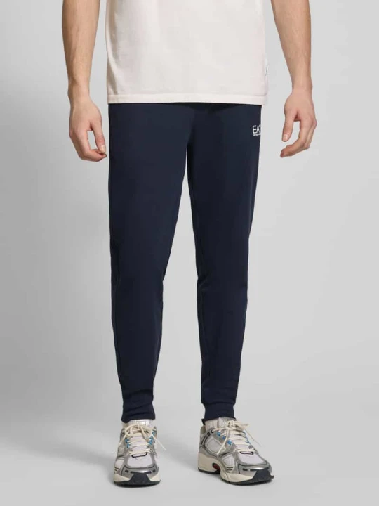 Zdjęcie produktu Spodnie dresowe z logo i elastycznym pasem EA7 Emporio Armani Ciemnoniebieski