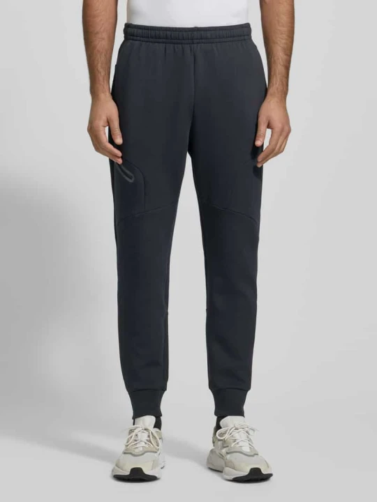 Zdjęcie produktu Spodnie dresowe z logo Model 'Unstoppable' Under Armour Czarny