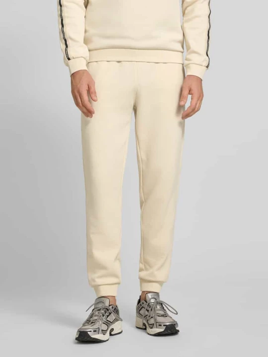 Zdjęcie produktu Spodnie dresowe z Mieszanka bawełny EA7 Emporio Armani Piaskowy