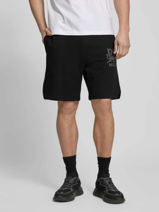 Zdjęcie produktu Spodnie dresowe z nadrukiem z logo model ‘DESWICK’ Hugo Czarny