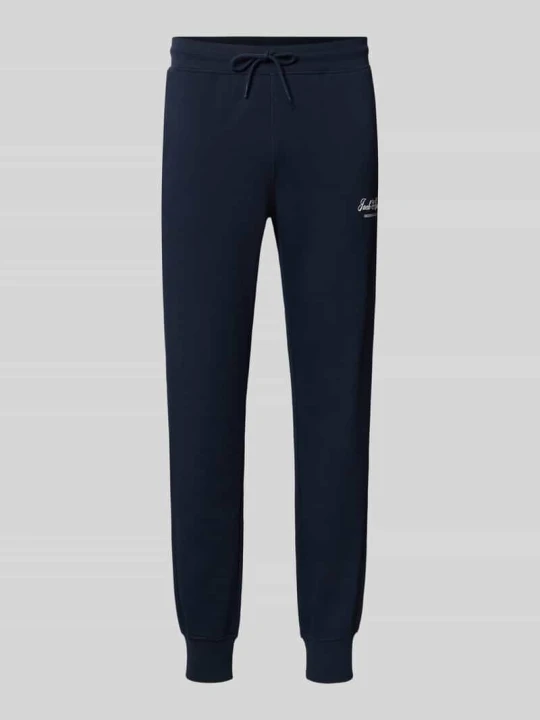 Zdjęcie produktu Spodnie dresowe z nadrukiem z logo model 'GORDON' Jack&Jones Ciemnoniebieski