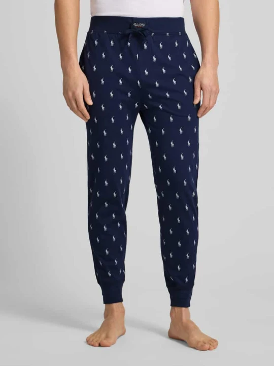 Zdjęcie produktu Spodnie dresowe z nadruk z logo na całej powierzchni Polo Ralph Lauren Ciemnoniebieski