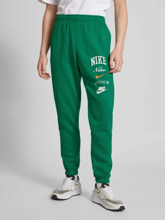 Zdjęcie produktu Spodnie dresowe z nadrukiem z logo Nike Zielony