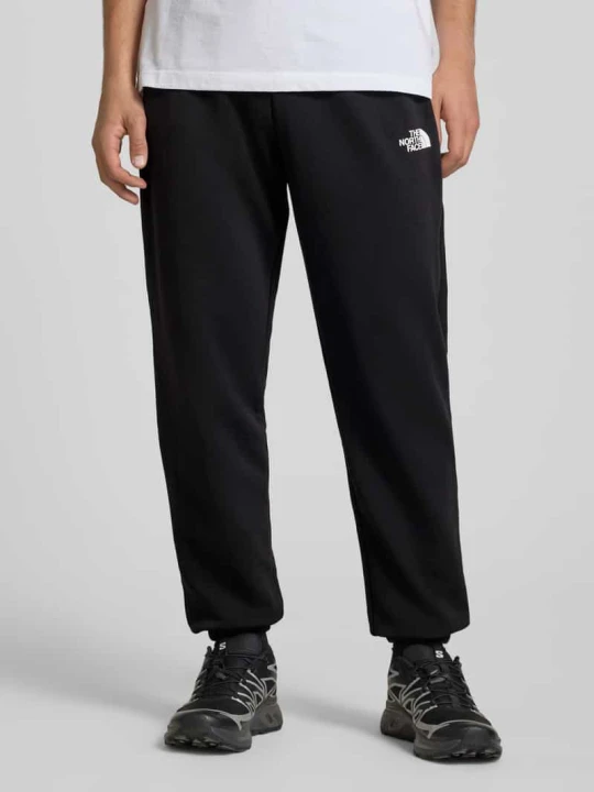 Zdjęcie produktu spodnie dresowe z nadrukiem z logo The North Face Czarny