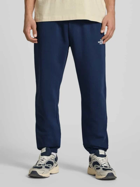 Zdjęcie produktu spodnie dresowe z nadrukiem z logo The North Face Granatowy