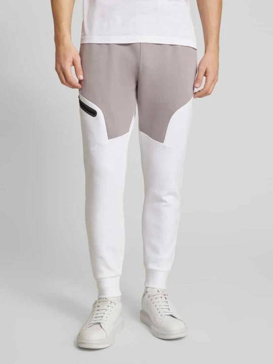 Zdjęcie produktu Spodnie dresowe z nadrukiem z logo Under Armour Jasnoszary