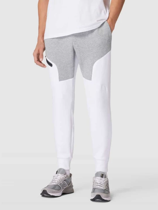 Zdjęcie produktu Spodnie dresowe z nadrukiem z logo Under Armour Jasnoszary