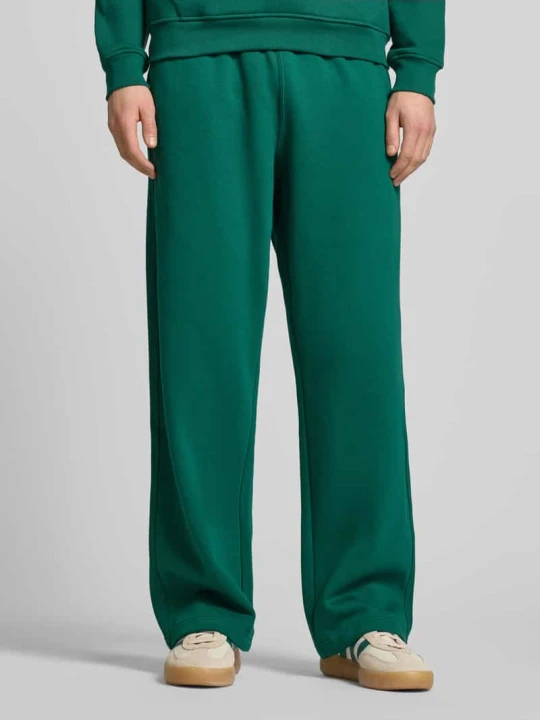 Zdjęcie produktu Spodnie dresowe o kroju wide fit z elastycznym pasem adidas Originals Zielony