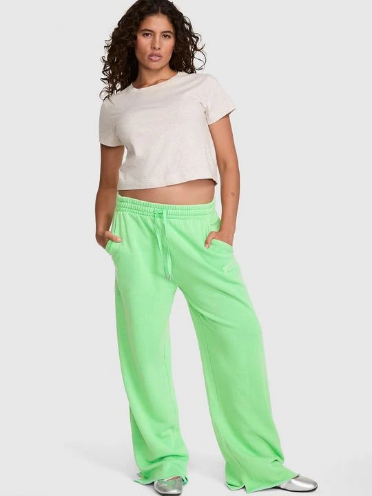 Zdjęcie produktu PINK Spodnie dresowe z szeroką nogawką i rozcięciem u dołu Campus Fleece Victoria's Secret Zielony