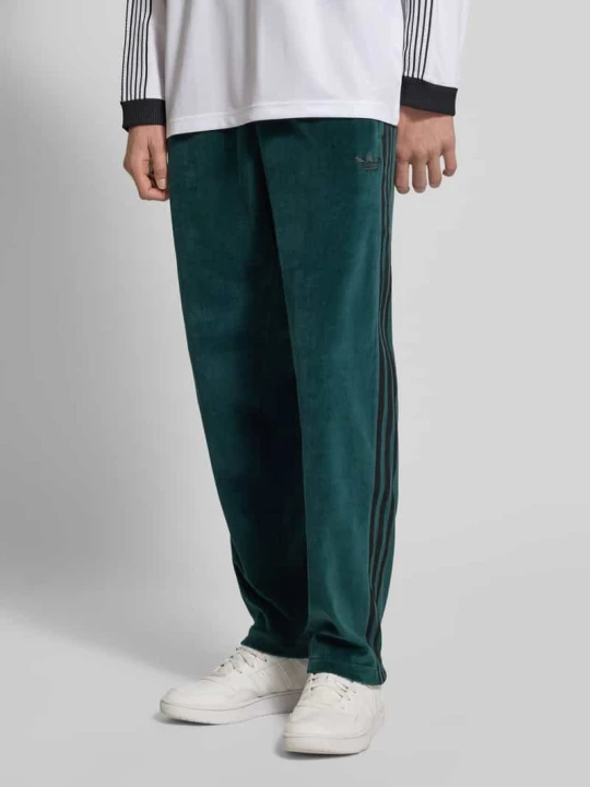 Zdjęcie produktu Spodnie dresowe z wpuszczanymi kieszeniami adidas Originals Ciemnozielony