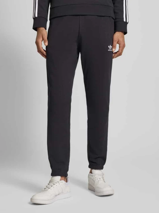 Zdjęcie produktu Spodnie dresowe z wyhaftowanym logo i elastycznym pasem adidas Originals Czarny