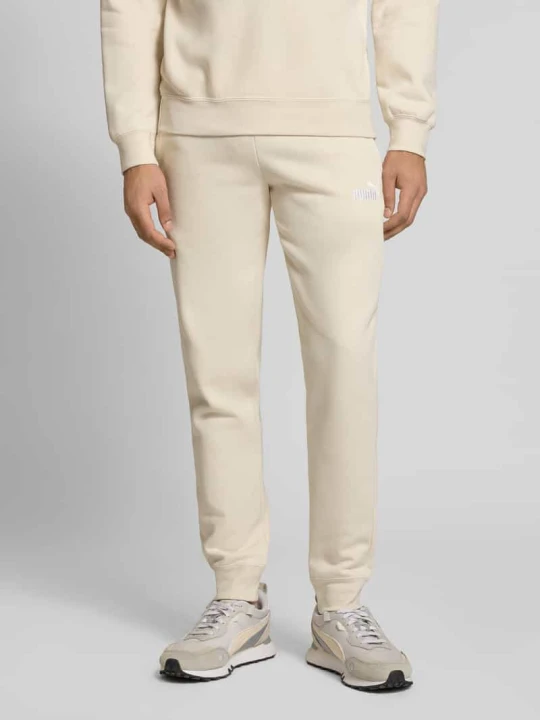 Zdjęcie produktu spodnie dresowe z wyhaftowanym logo Puma Złamany biały