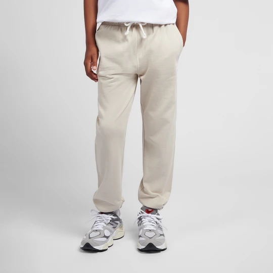 Zdjęcie produktu Spodnie dziecięce New Balance LAKB0060TWF – beżowe