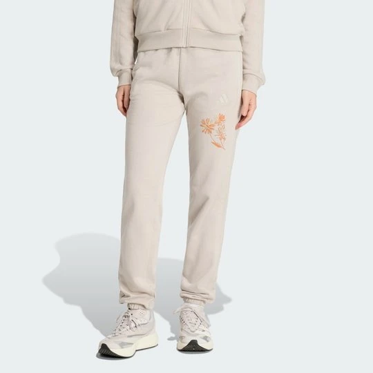 Zdjęcie produktu Spodnie frotté z mankietami Essentials z 3 paskami Adidas beżowy