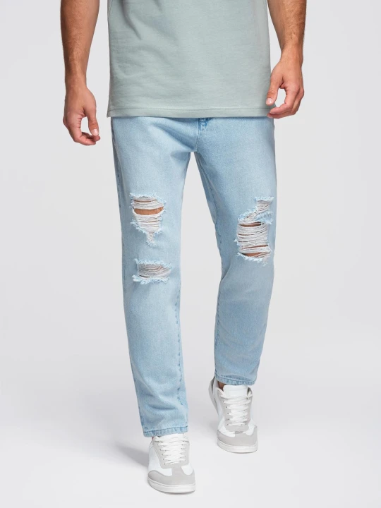 Zdjęcie produktu Spodnie jeansowe męskie CARROT FIT z przetarciami – jasnoniebieskie V1 - Rozmiar: L Ombre Clothing