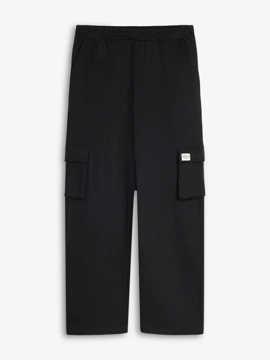 Zdjęcie produktu Spodnie joggingowe z kieszeniami, z miękkiej bawełny organicznej, loose fit BonPrix czarny