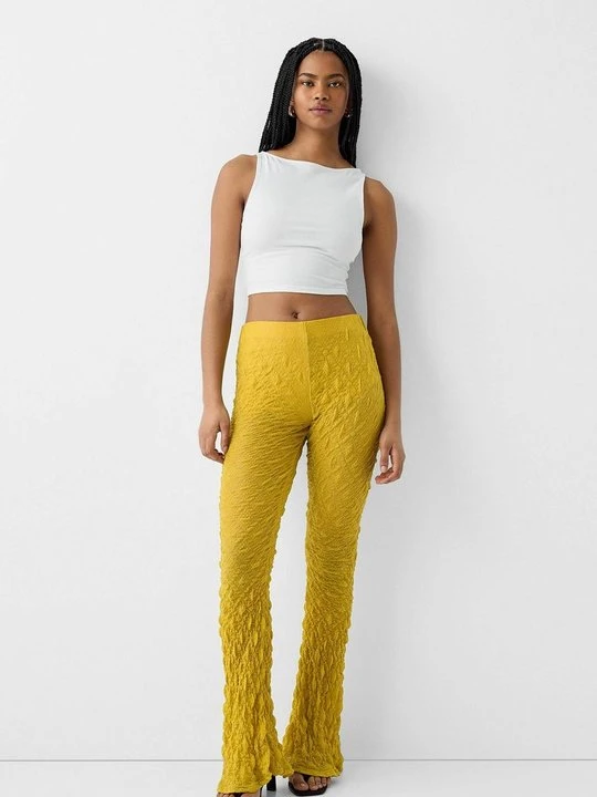 Zdjęcie produktu Spodnie materiałowe Bershka żółty