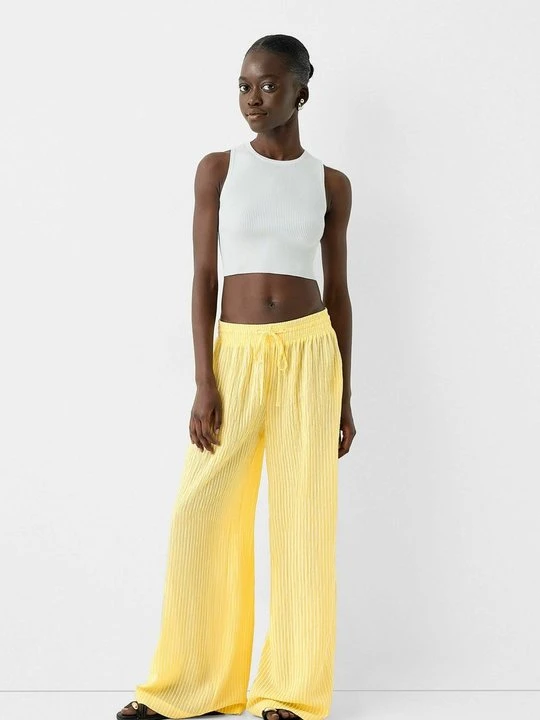 Zdjęcie produktu Spodnie materiałowe Bershka żółty