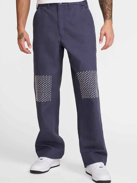Zdjęcie produktu Spodnie materiałowe Nike niebieski