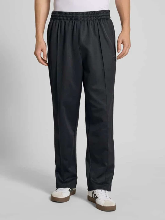 Zdjęcie produktu Spodnie dresowe o kroju baggy fit z mieszanki bawełny w kant adidas Originals Czarny