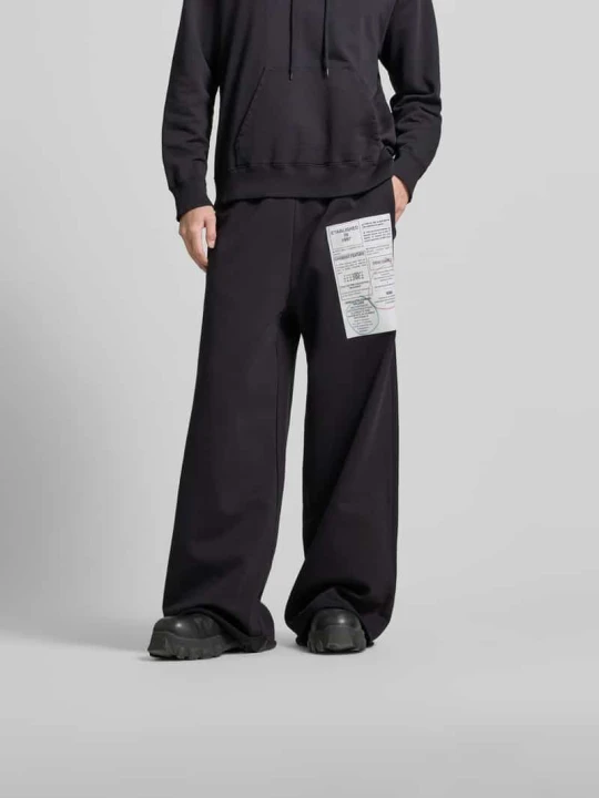 Zdjęcie produktu Spodnie materiałowe o kroju loose fit z nadrukiem logo MM6 Maison Margiela Ciemnobrązowy
