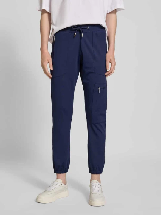 Zdjęcie produktu Spodnie materiałowe o kroju slim fit z kieszeniami zapinanymi na zamek błyskawiczny Monari Granatowy