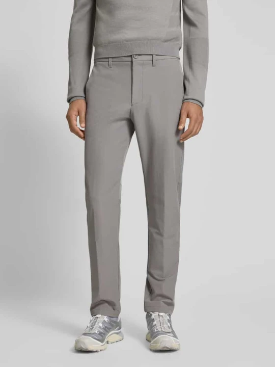 Zdjęcie produktu Spodnie materiałowe o kroju slim fit z wodoodpornego materiału model ‘COMMUTER’ Boss Jasnoszary