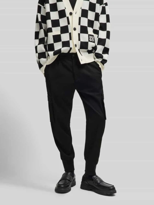 Zdjęcie produktu Spodnie materiałowe o kroju tapered fit z zakładkami w pasie model ‘GALVIN241’ Hugo Czarny