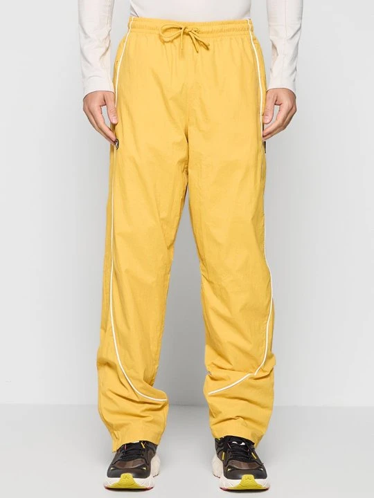 Zdjęcie produktu Spodnie materiałowe Under Armour żółty