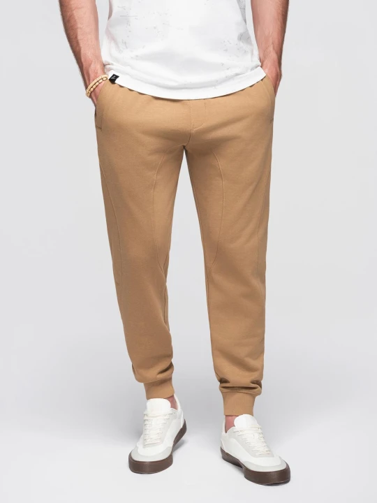 Zdjęcie produktu Spodnie męskie dresowe typu jogger - brązowe V2 - Rozmiar: M Ombre Clothing