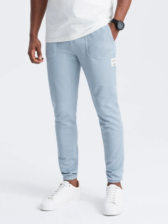 Zdjęcie produktu Spodnie męskie dresowe ze strukturalnej dzianiny - jasnoniebieskie V4 - Rozmiar: XL Ombre Clothing