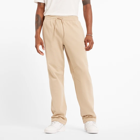 Zdjęcie produktu Spodnie męskie New Balance MP44587SNW – beżowe
