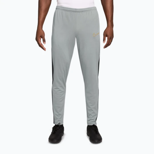 Zdjęcie produktu Spodnie męskie Nike Academy Dri-Fit light smoke grey/white/black/metallic gold