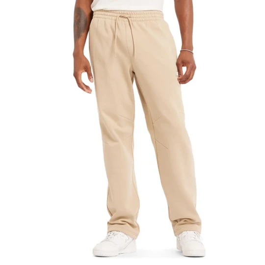 Zdjęcie produktu Spodnie New Balance MP44587SNW - beżowe