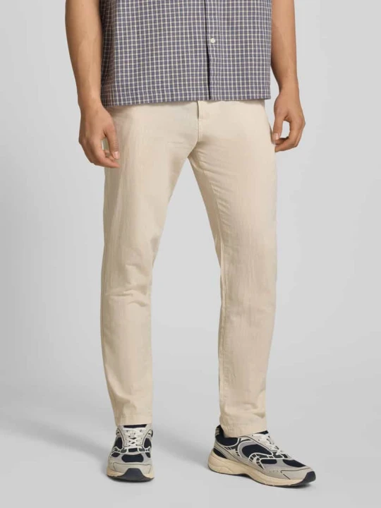 Zdjęcie produktu Spodnie o kroju tapered fit z wpuszczanymi kieszeniami model 'STACE' Jack&Jones Jasnoszary