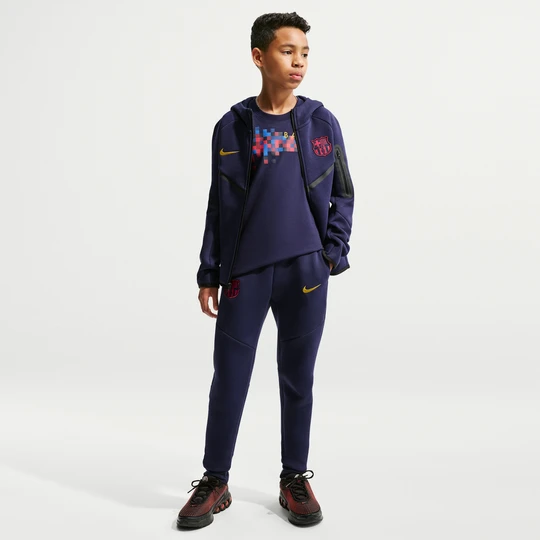 Zdjęcie produktu Spodnie piłkarskie dla dużych dzieci (chłopców) Nike FC Barcelona Tech Fleece - Niebieski