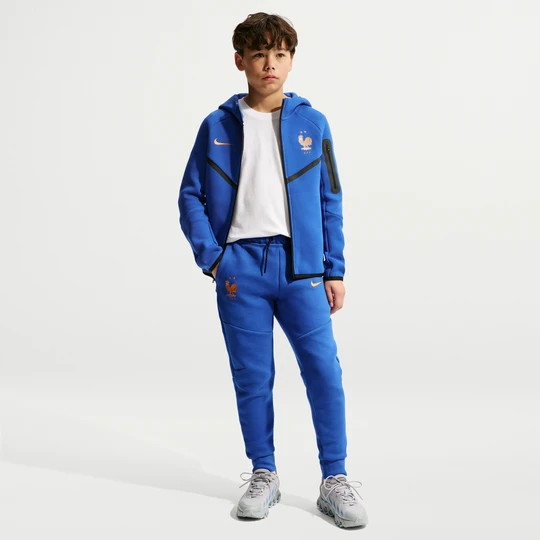 Zdjęcie produktu Spodnie piłkarskie dla dużych dzieci (chłopców) Nike FFF Tech Fleece - Niebieski