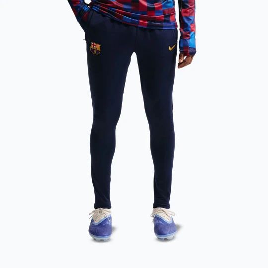 Zdjęcie produktu Spodnie piłkarskie męskie Nike FC Barcelona Strike Dri-Fit blackened blue/noble red/yellow Granatowy