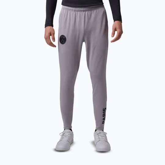 Zdjęcie produktu Spodnie piłkarskie męskie Nike Paris Saint-Germain Strike SE atmosphere grey / black / black